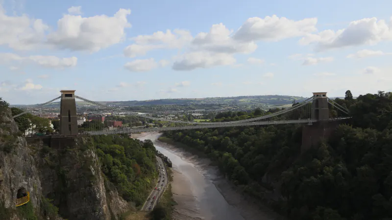 Clifton Suspension Bridge spanning the Avon Gorge above the river, with Bristol beyond