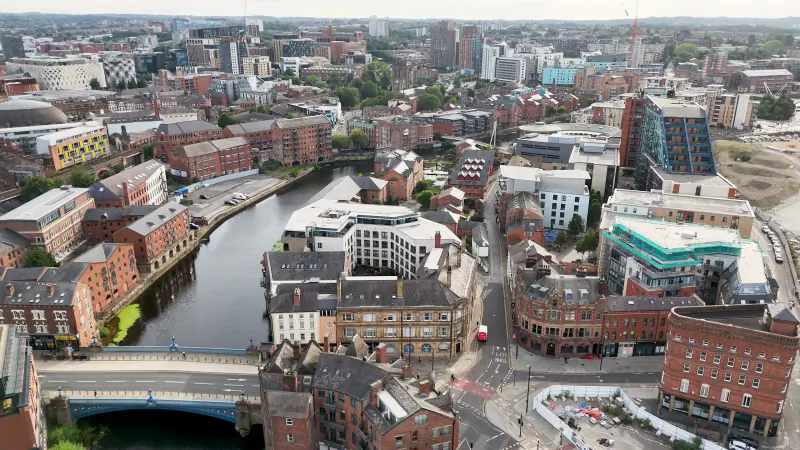 Aerial view of the River Aire and the mix of Victorian and modern buildings in Leeds city centre