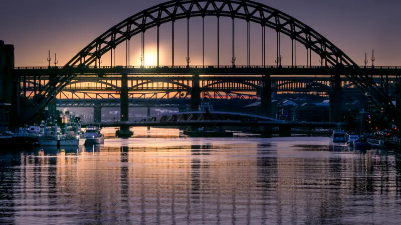 The Tyne Bridge and the other bridges over the River Tyne at sunset, seen from the Newcastle quayside