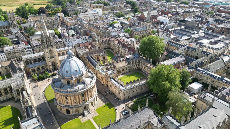 Aerial view over central Oxford with the dome of the Radcliffe Camera among the college rooftops and spires