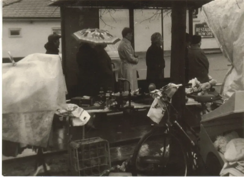 Bus stop and market stall on Finchley Road, Swiss Cottage, London