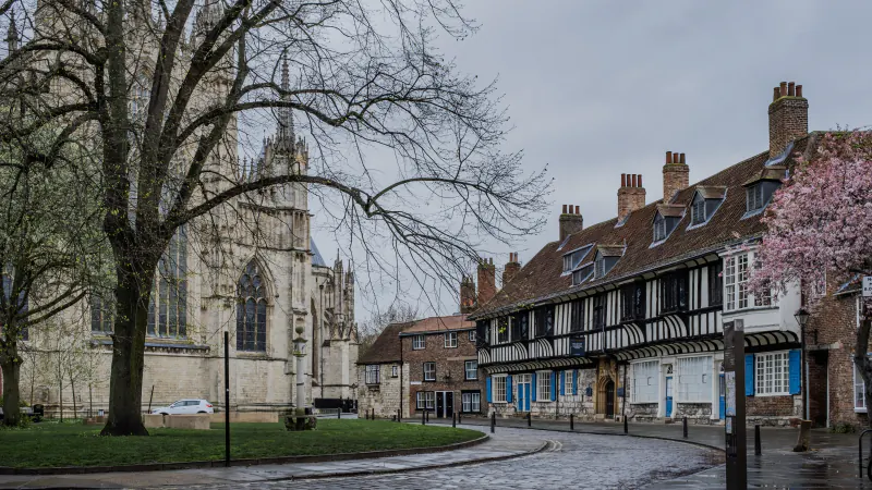 York Minster beside the half-timbered houses of College Street in York