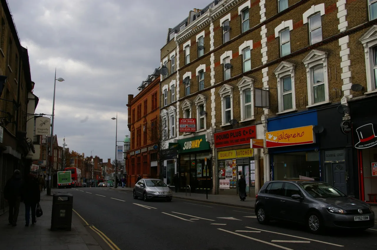 Acton High Street with shops and pedestrians