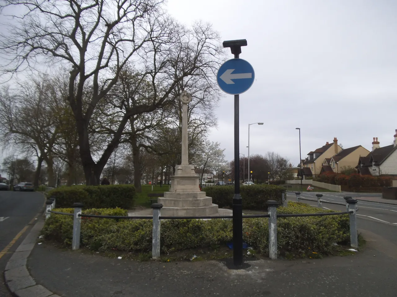 Woodside war memorial on a road island near Broad Green, on a clear day