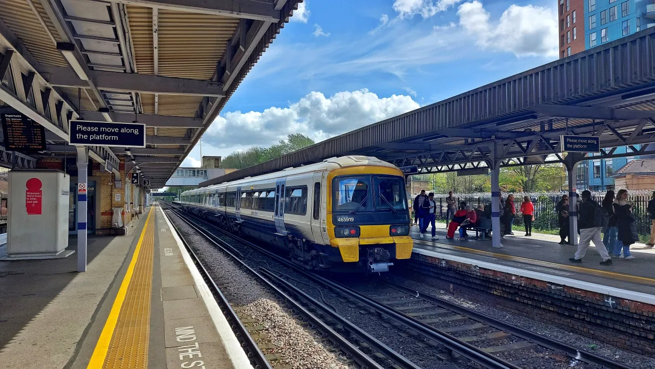 A train waiting at a platform at Bromley South station on a sunny day