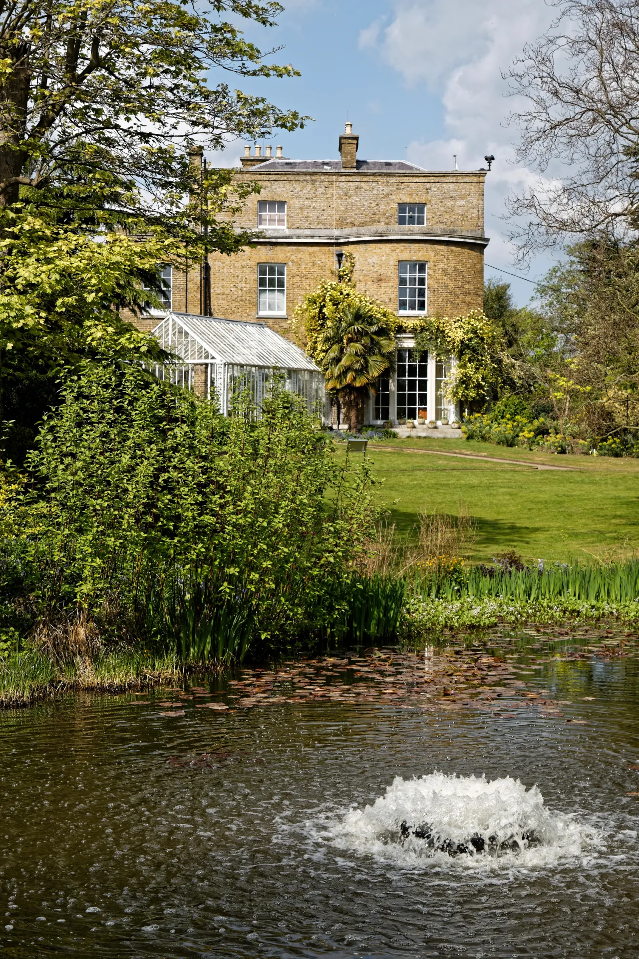 Myddelton House across the lake in its Enfield gardens near Bulls Cross