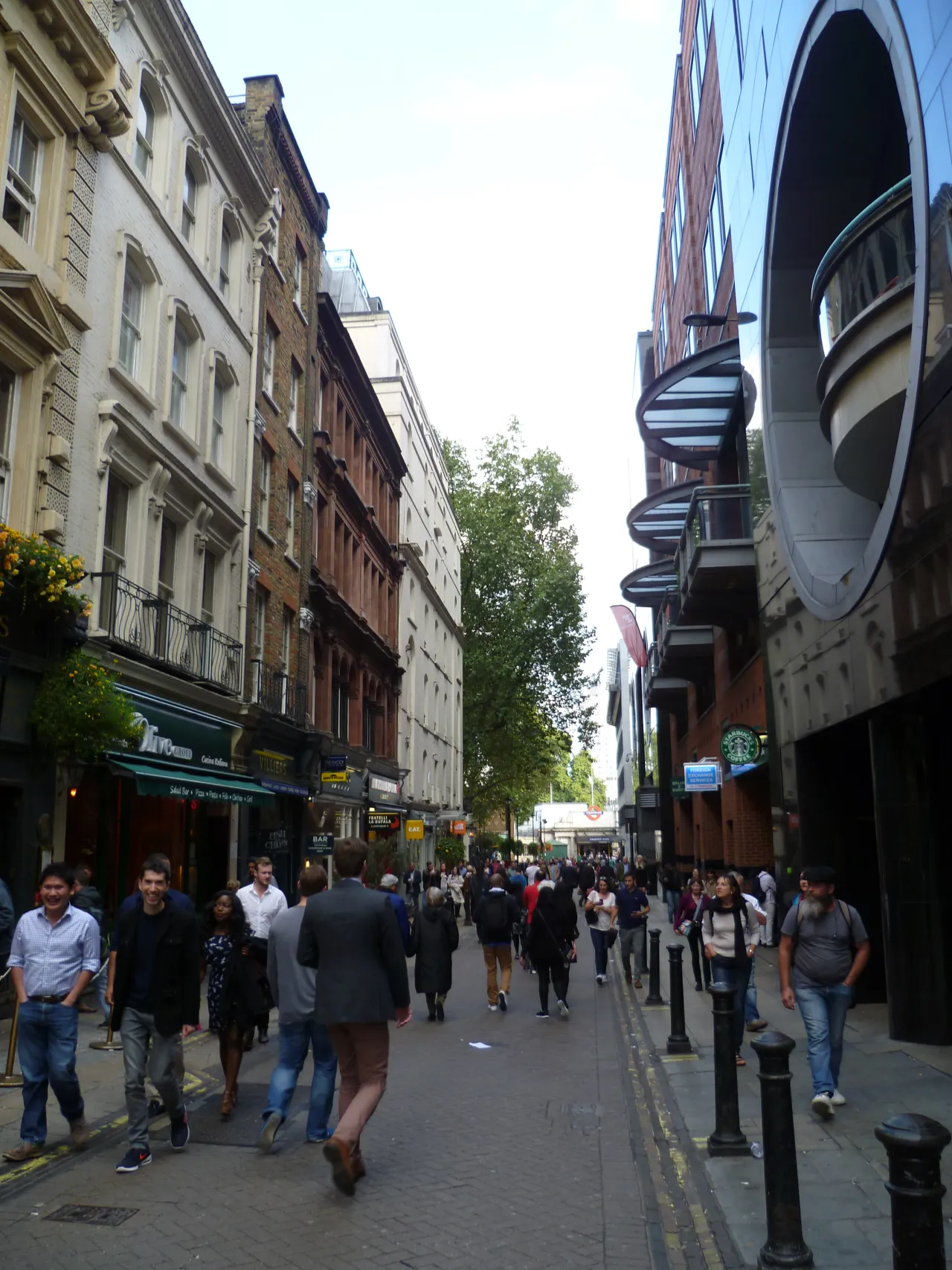 Villiers Street near Charing Cross station, London, busy with pedestrians