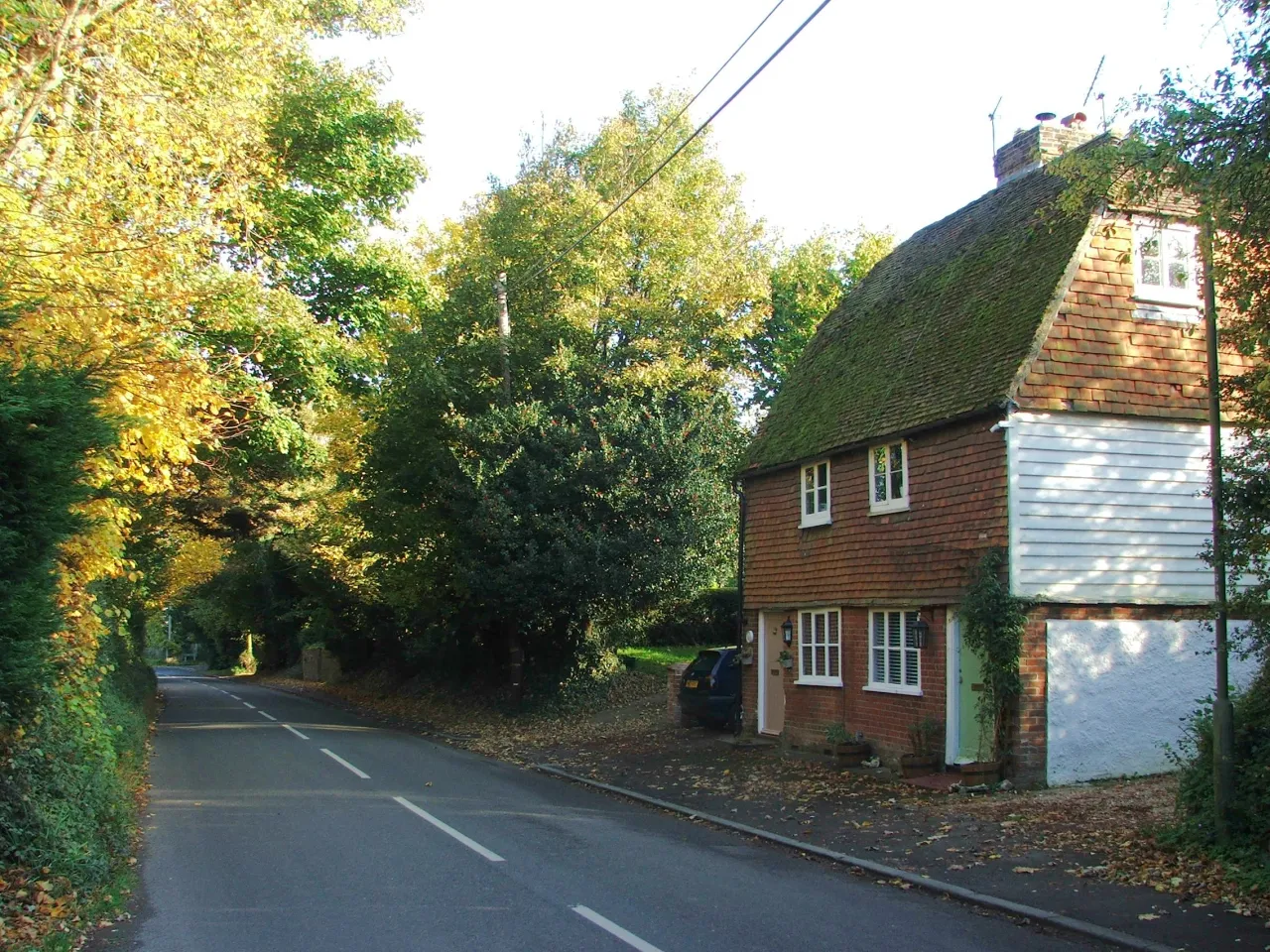 Bucks Cross Road in Chelsfield, a tree-lined lane past a traditional Kent cottage