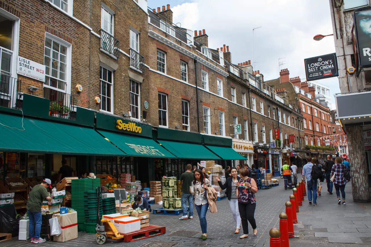 Lisle Street in Chinatown, London, with shops and pedestrians