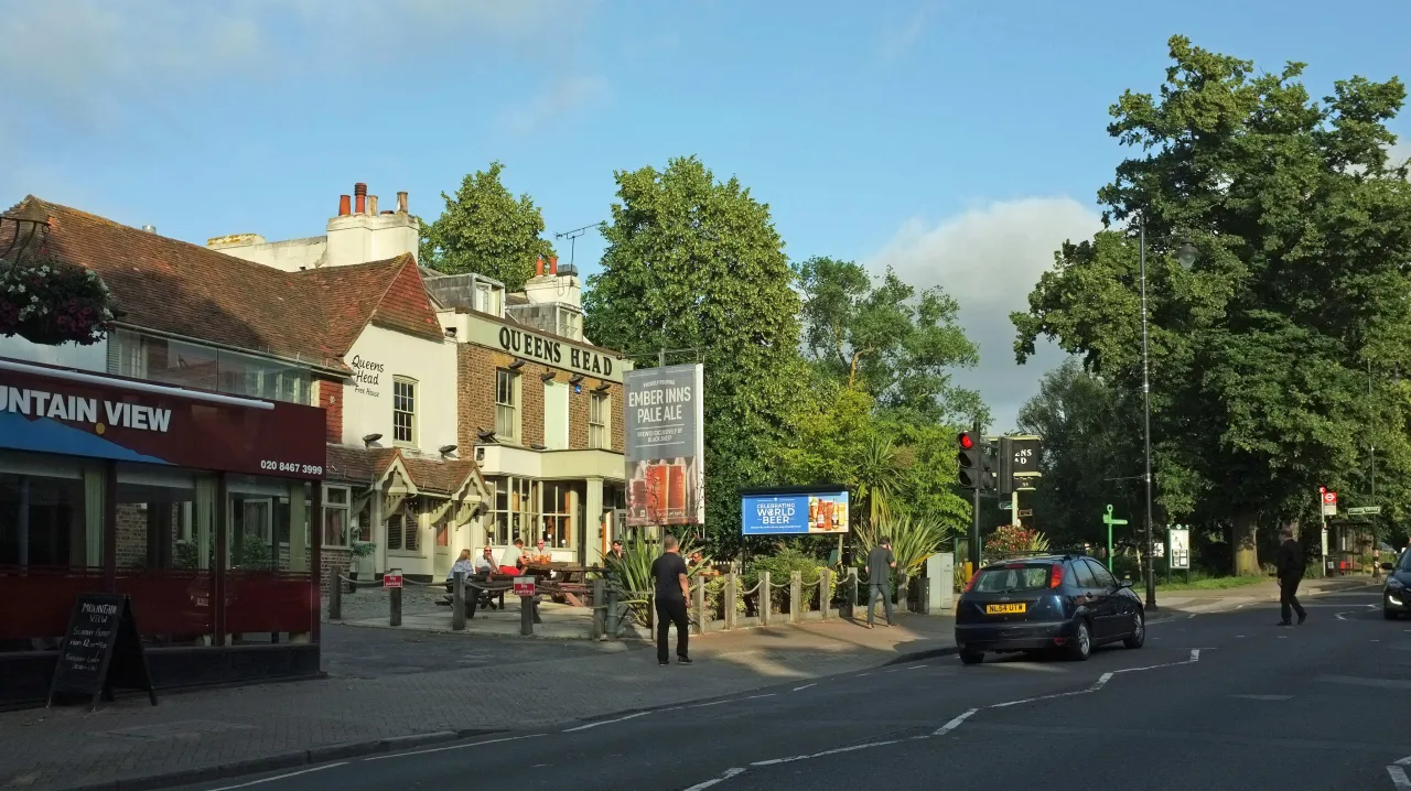 Chislehurst High Street, shops and cafes on a sunny day High Street