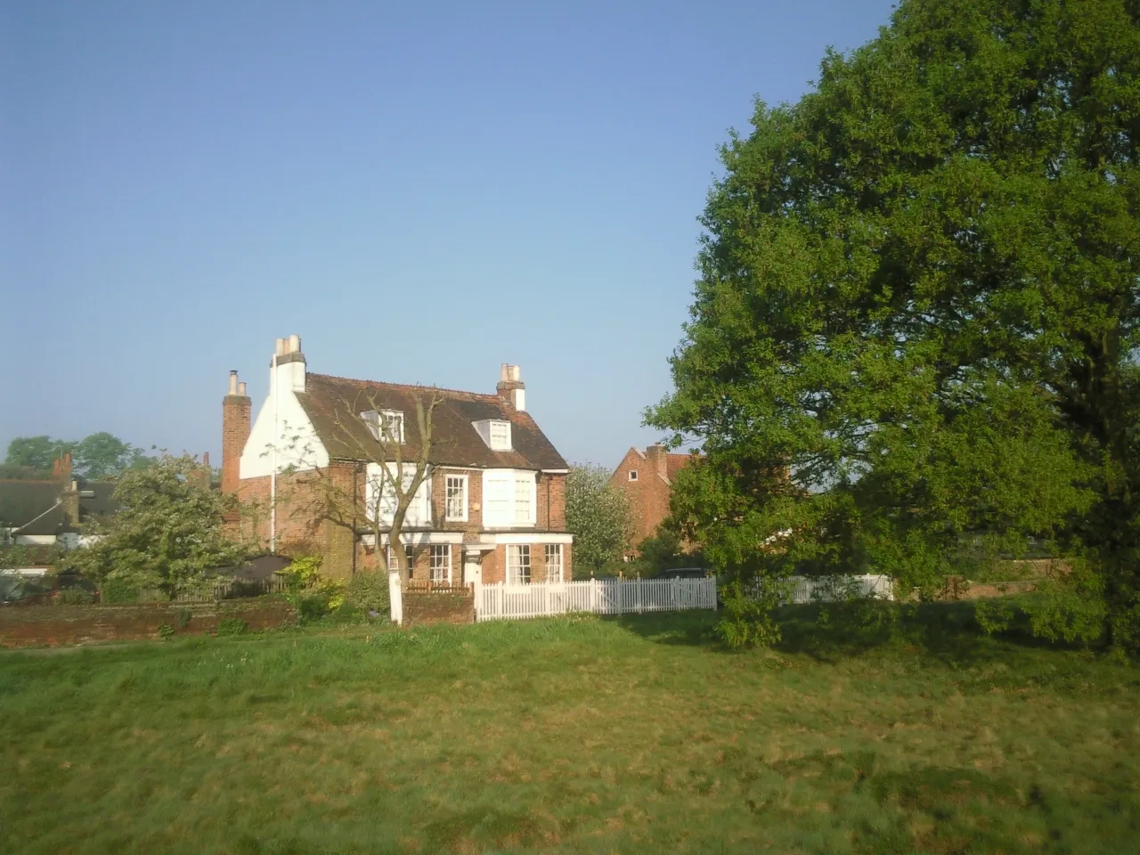 A house bordering the open green expanse of Chislehurst Common