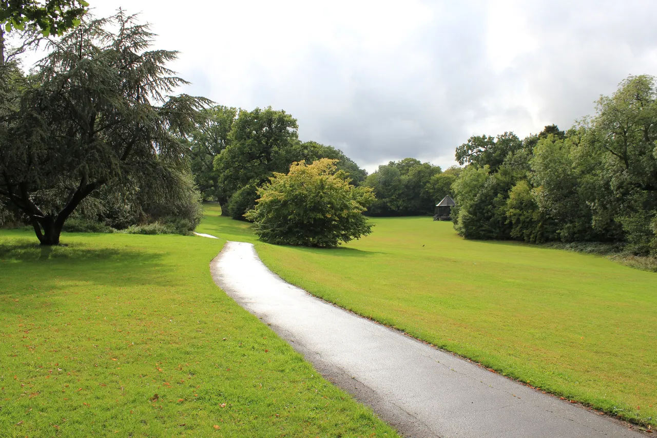 Open green space and a footpath at Hilly Fields Park, near Clay Hill in Enfield