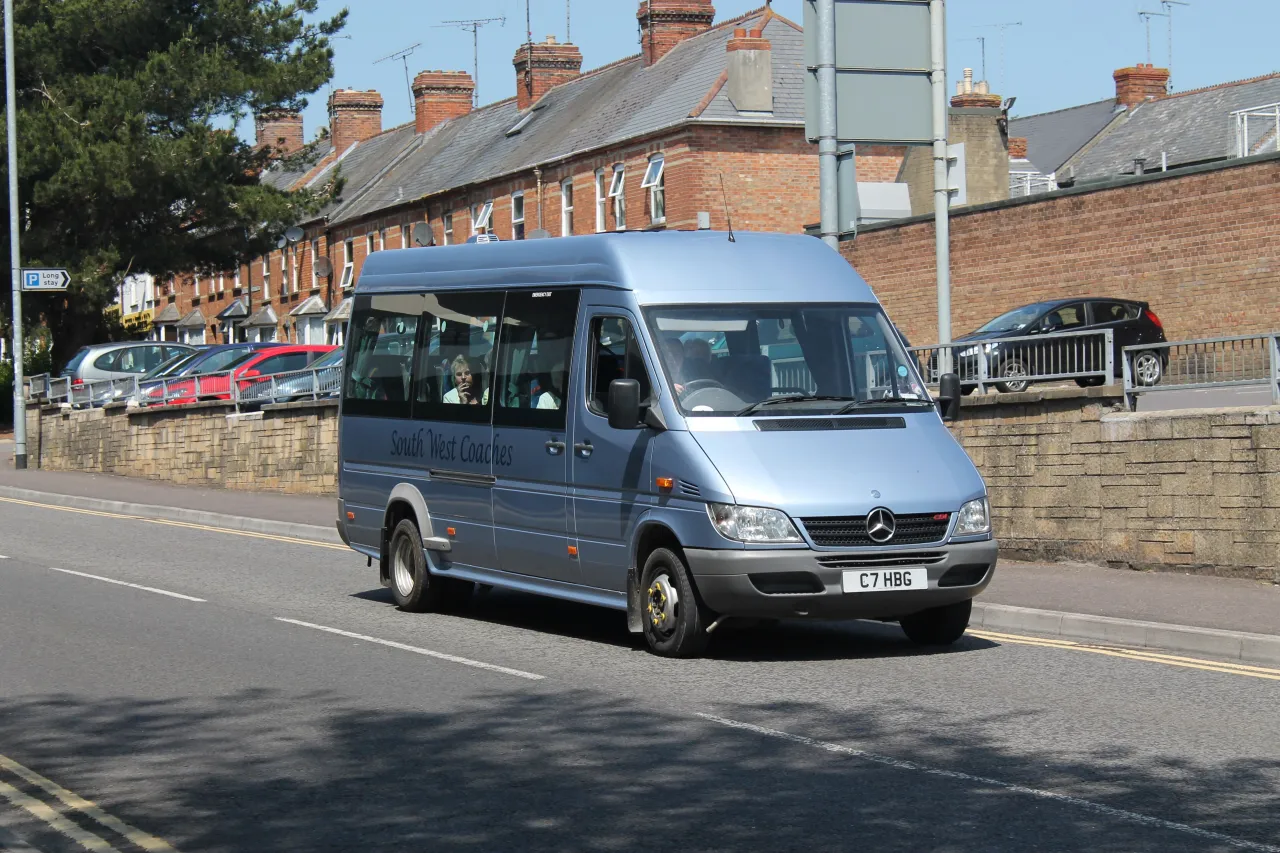 A minibus on a UK residential street, ready to get started with a new booking
