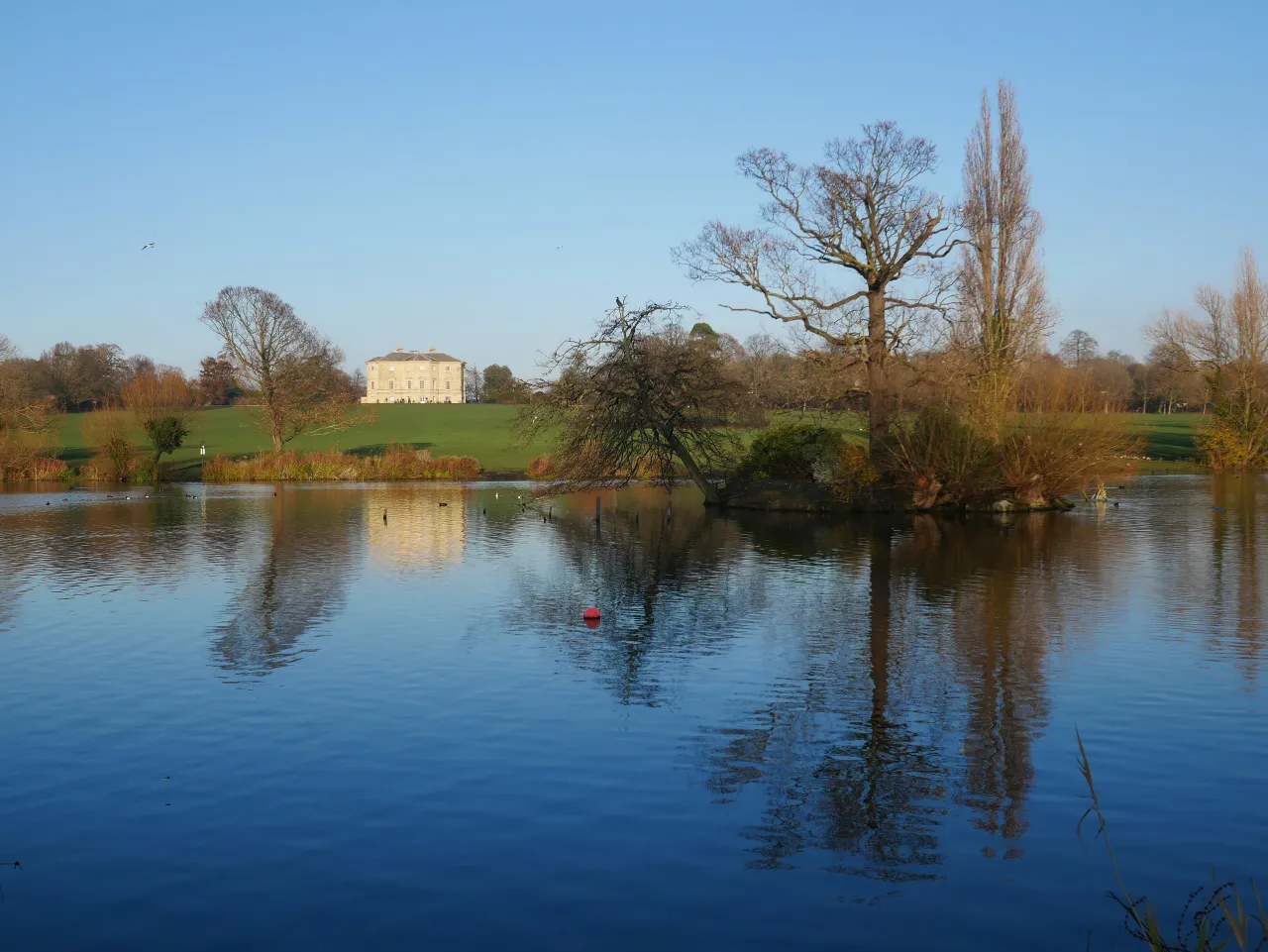 Danson Park lake in Bexleyheath, with Danson House beyond, a short drive from Crook Log