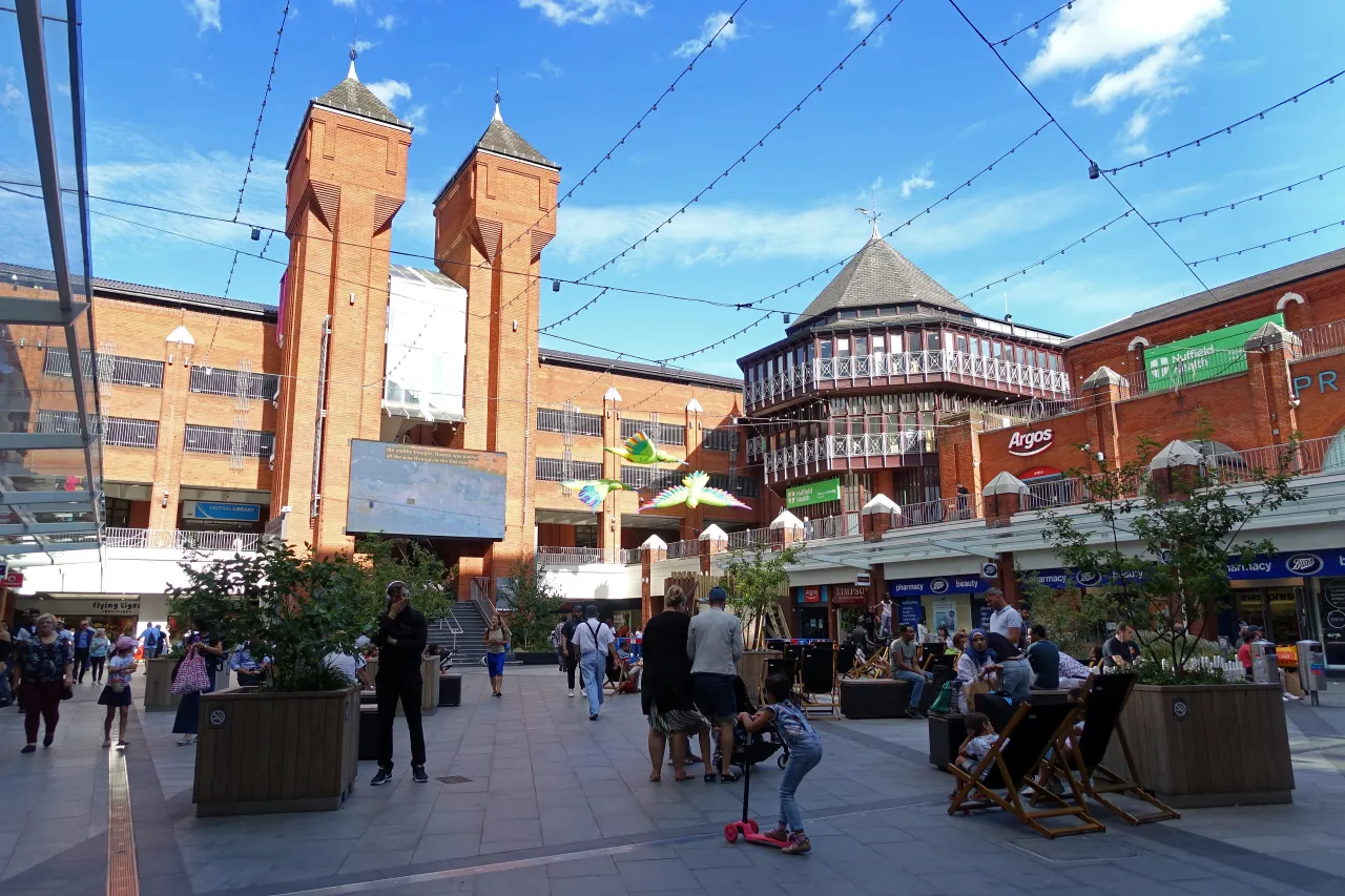 Ealing Broadway shopping centre plaza with people, Ealing, London