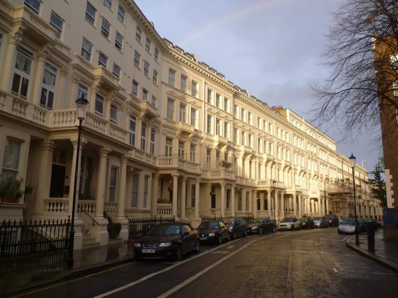 Terraced stucco houses on Earls Court Square, west London, in evening light