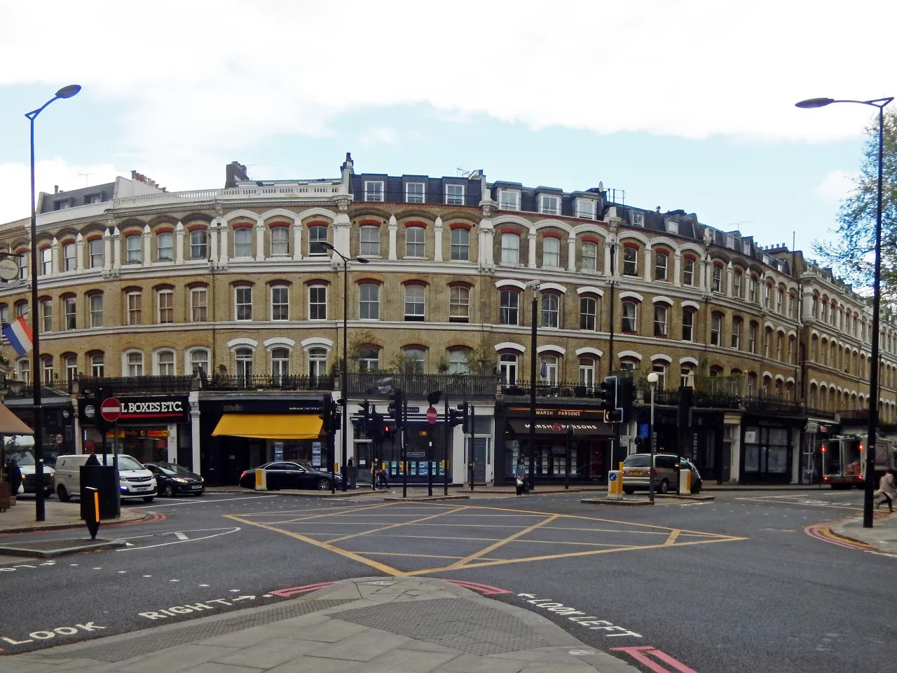 Old Brompton Road in Earl's Court, a curving parade of Victorian shopfronts