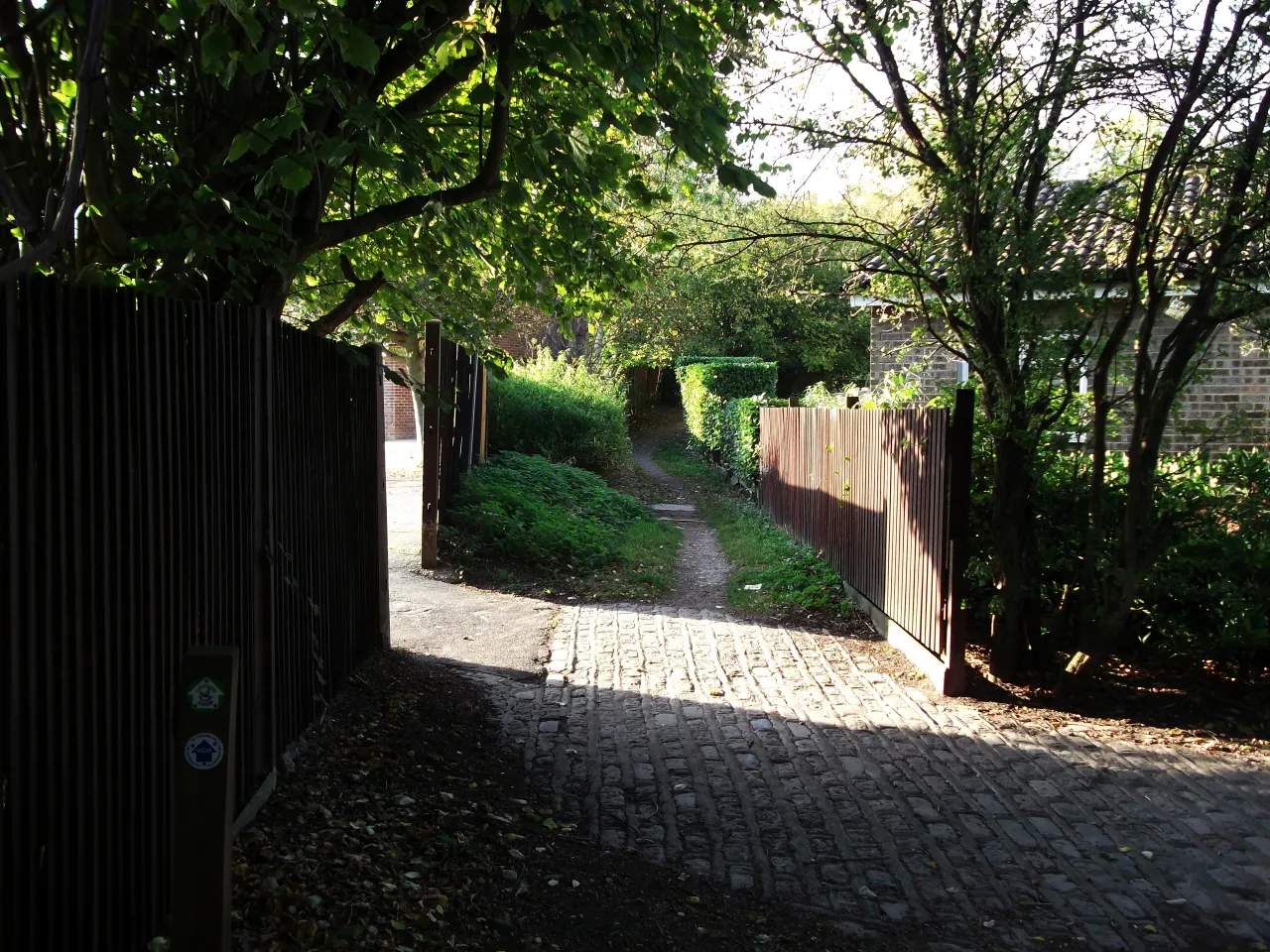 The London Loop path near Goldfinch Road in Forestdale, Croydon, edged by fencing and trees