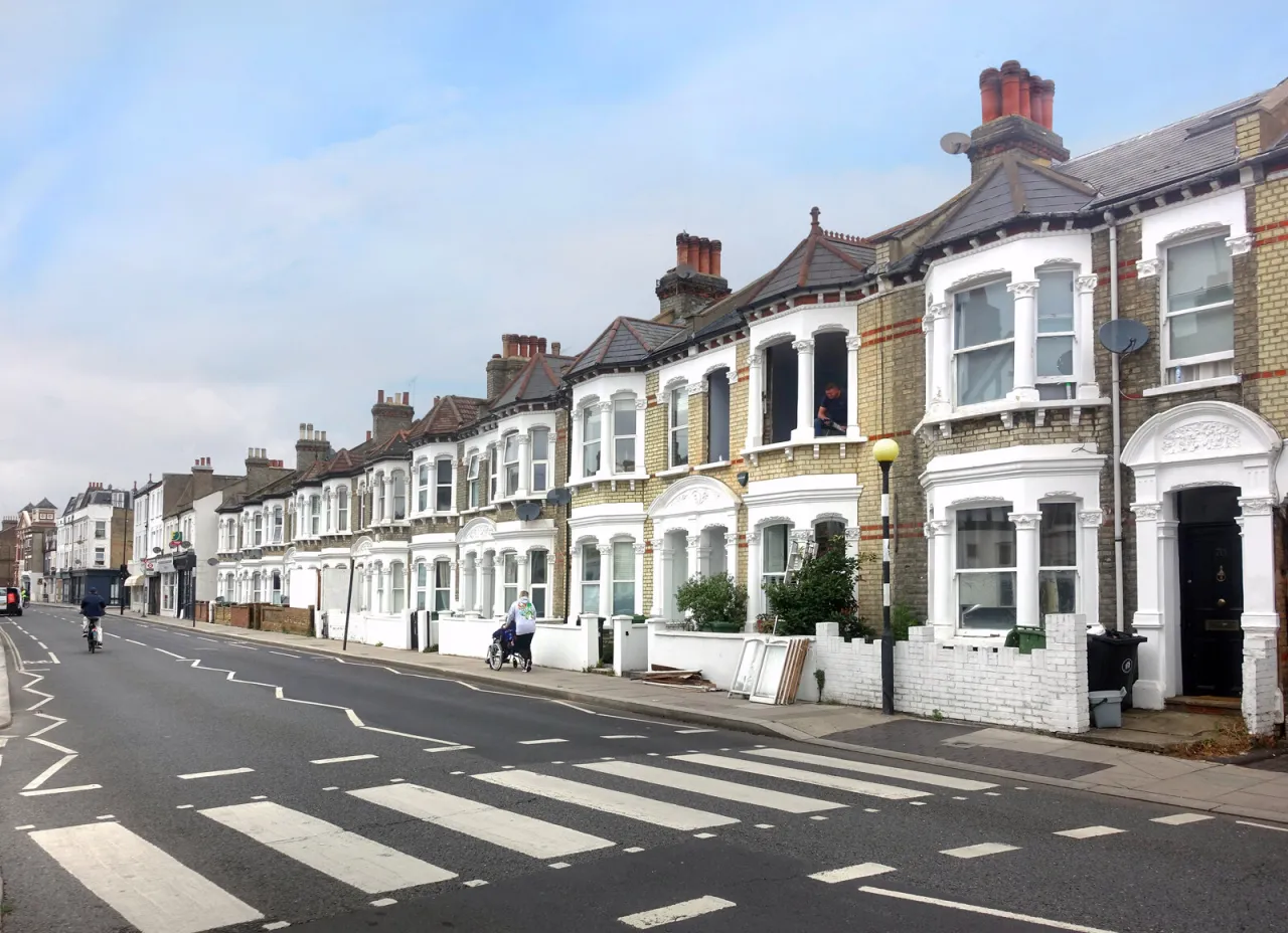Terraced Victorian houses along Dawes Road, Fulham, on a residential street