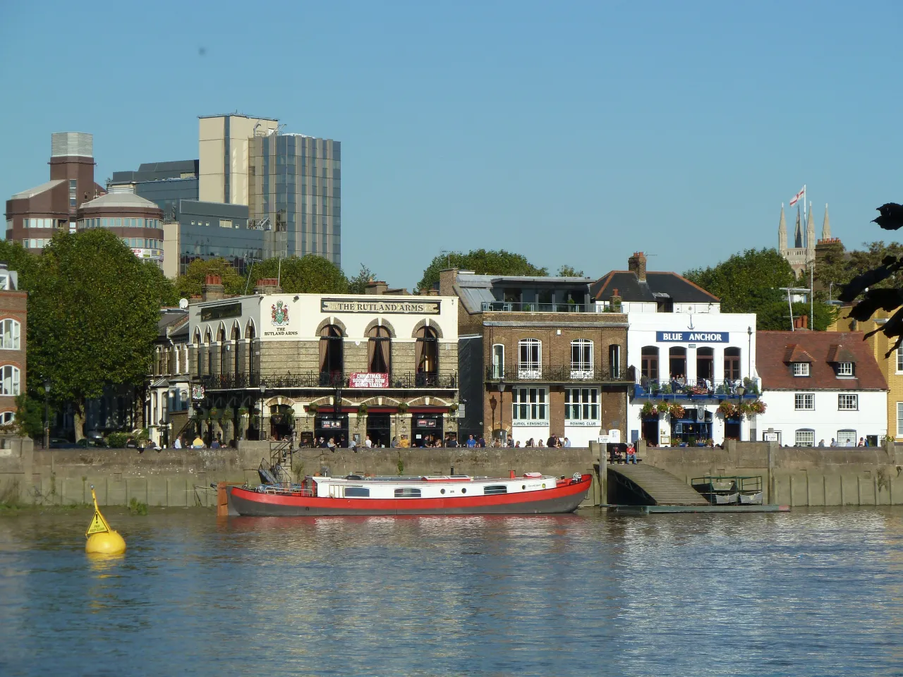 Riverside pubs on the Thames at Hammersmith, seen from the river