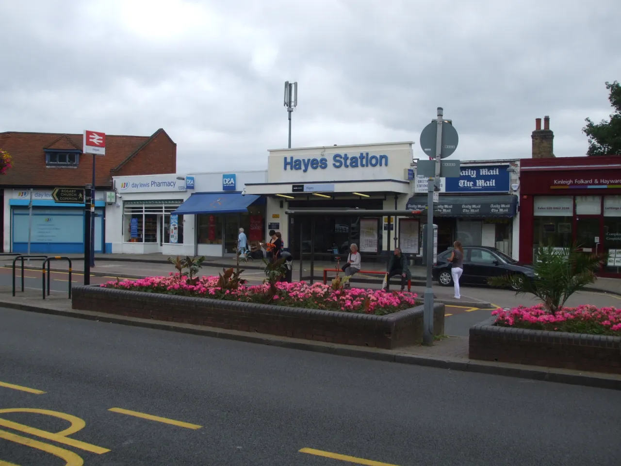 The forecourt and shopfronts outside Hayes railway station