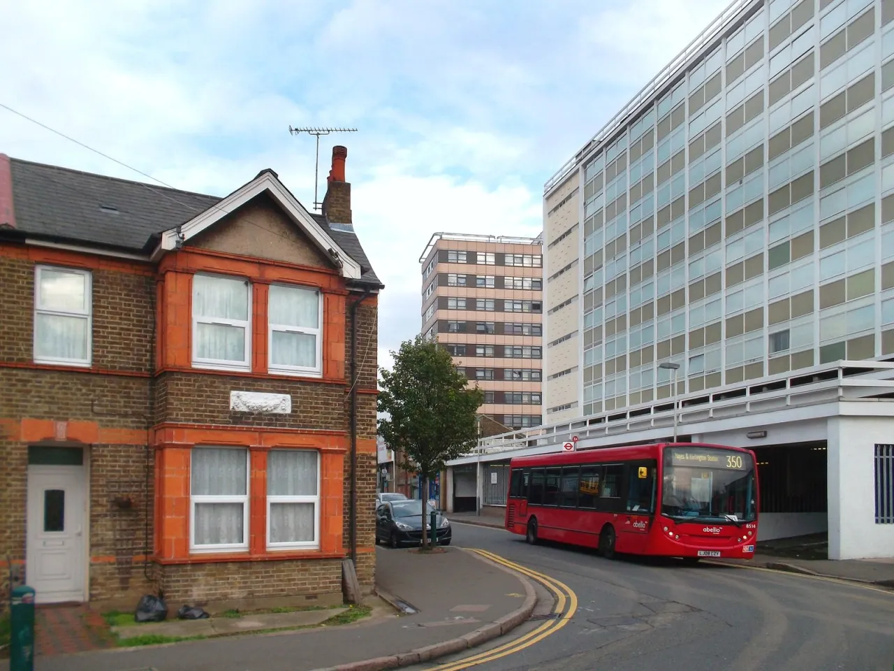 A terraced house on Blyth Road, Hayes, with modern buildings behind