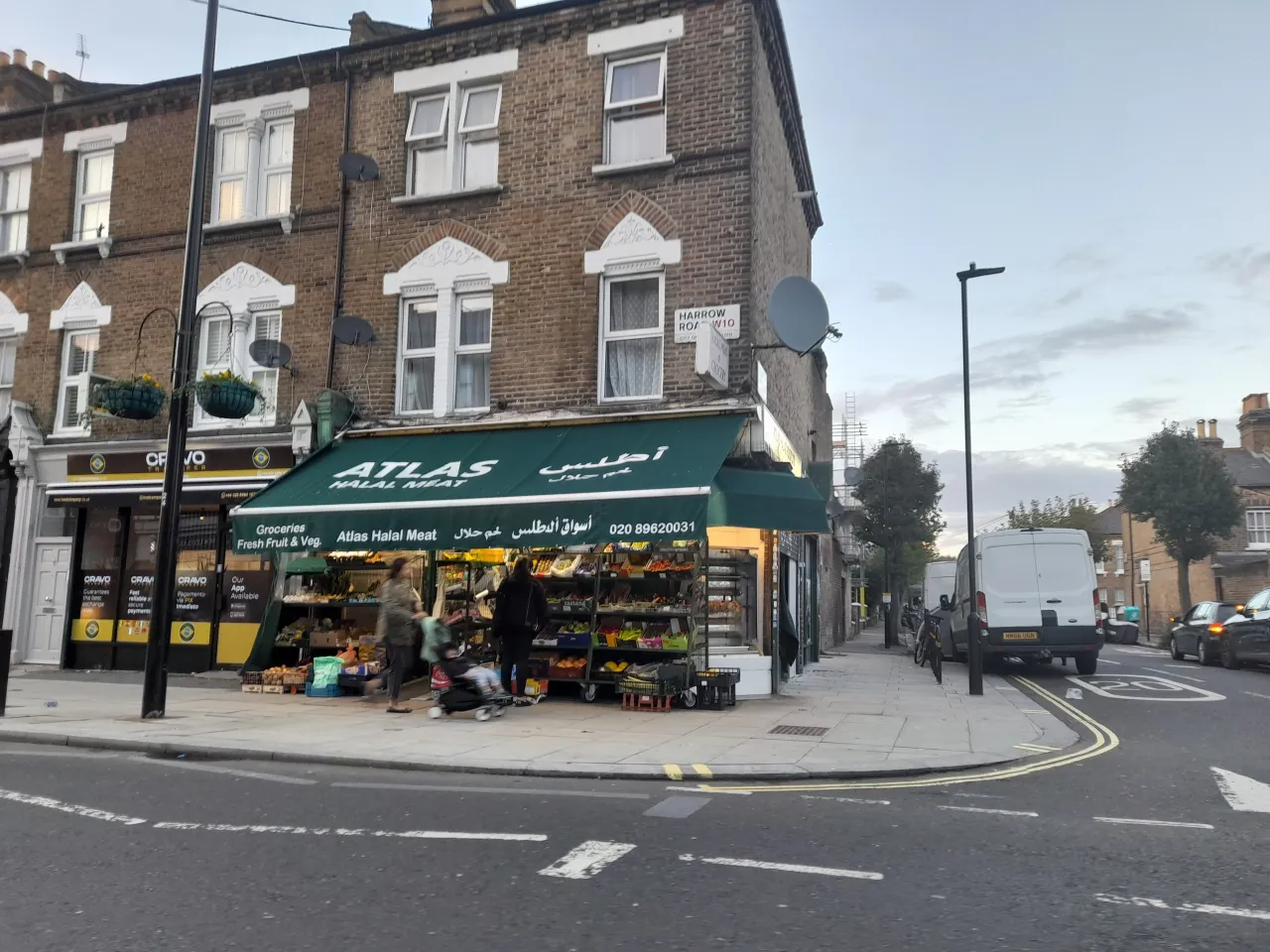 A corner shop and terraced parade on Harrow Road, Kensal Green