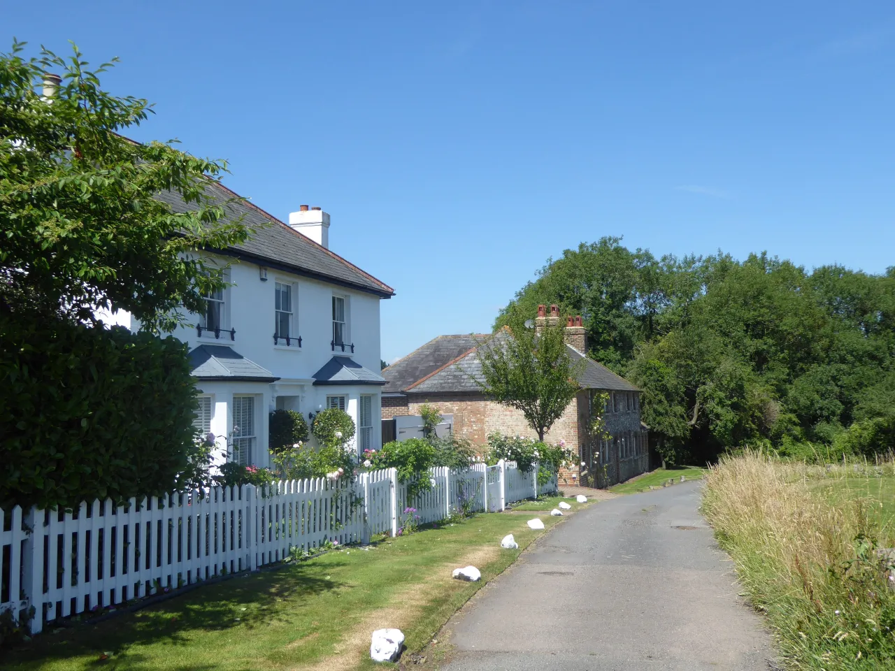 A cottage with white picket fence on the edge of Leaves Green