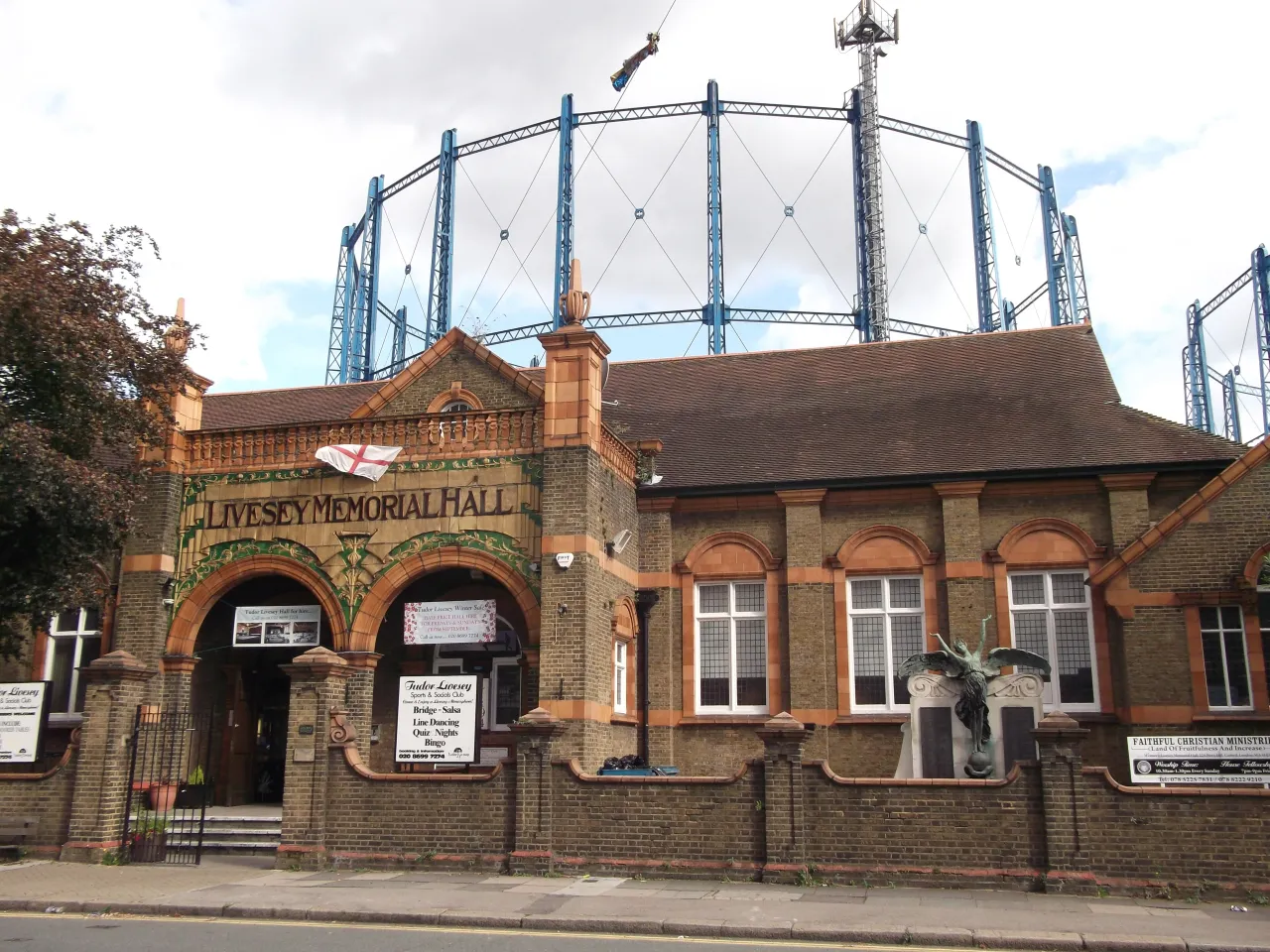 Livesey Memorial Hall at Bell Green, with the gasholder frame behind it