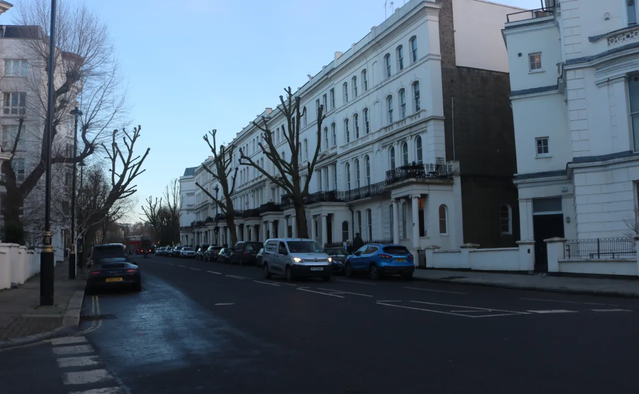 Warwick Avenue, Maida Vale, a tree-lined street of white stucco terraces