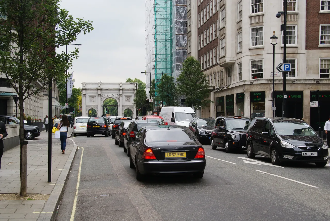 Great Cumberland Place with traffic and Marble Arch visible in the distance