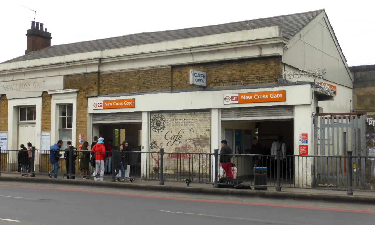 New Cross Gate station entrance on New Cross Road, with passengers outside