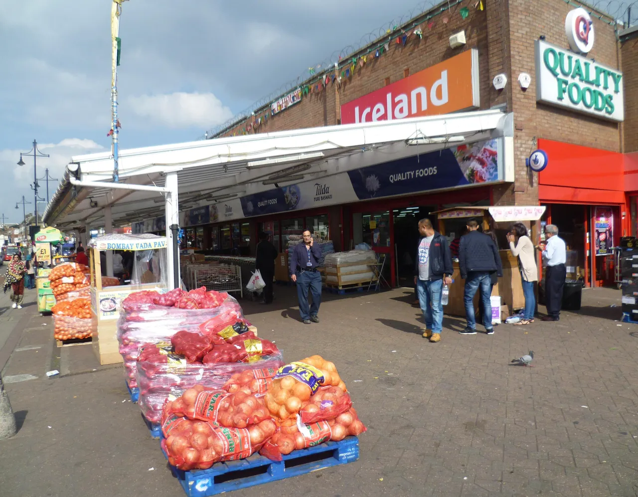 Market stalls and shops on South Road in nearby Southall, Ealing
