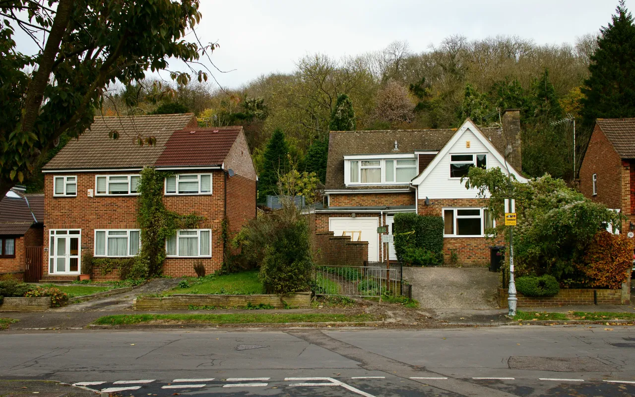 Houses near Caterham Drive in Old Coulsdon, with the wooded hillside behind