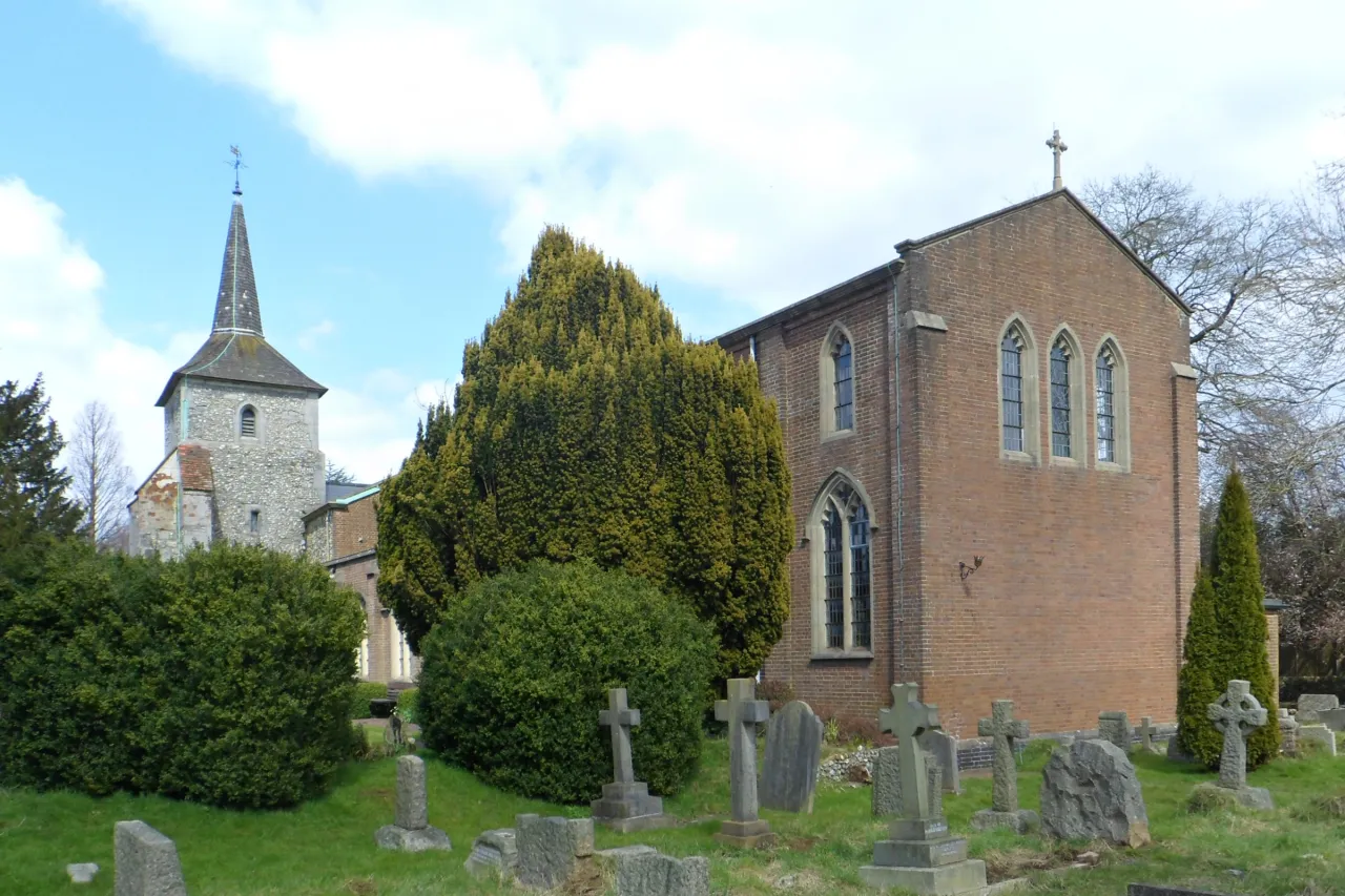 St John the Evangelist parish church, Old Coulsdon, seen across its churchyard on a clear day