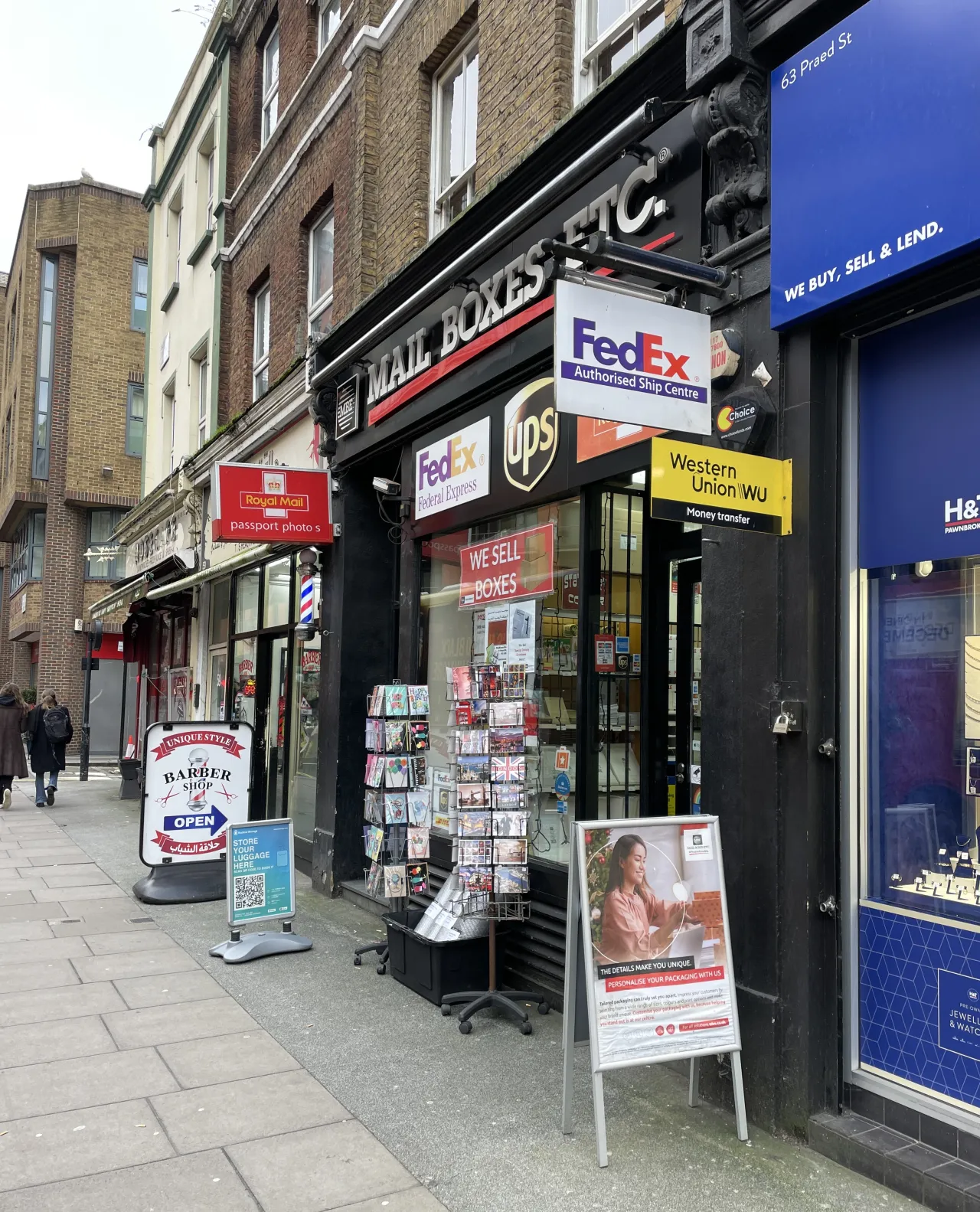 Shops and shopfronts along Praed Street, Paddington, in daylight