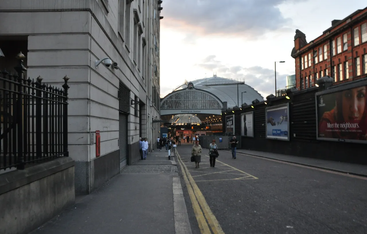 Street view of Paddington station's historic arched roof seen from Praed Street
