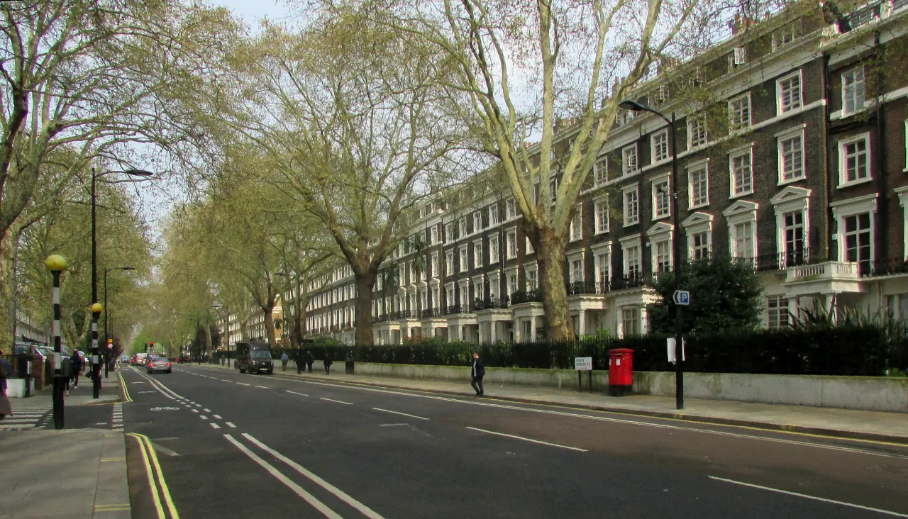 Tree-lined Georgian terrace on Sussex Gardens, Paddington, in daylight