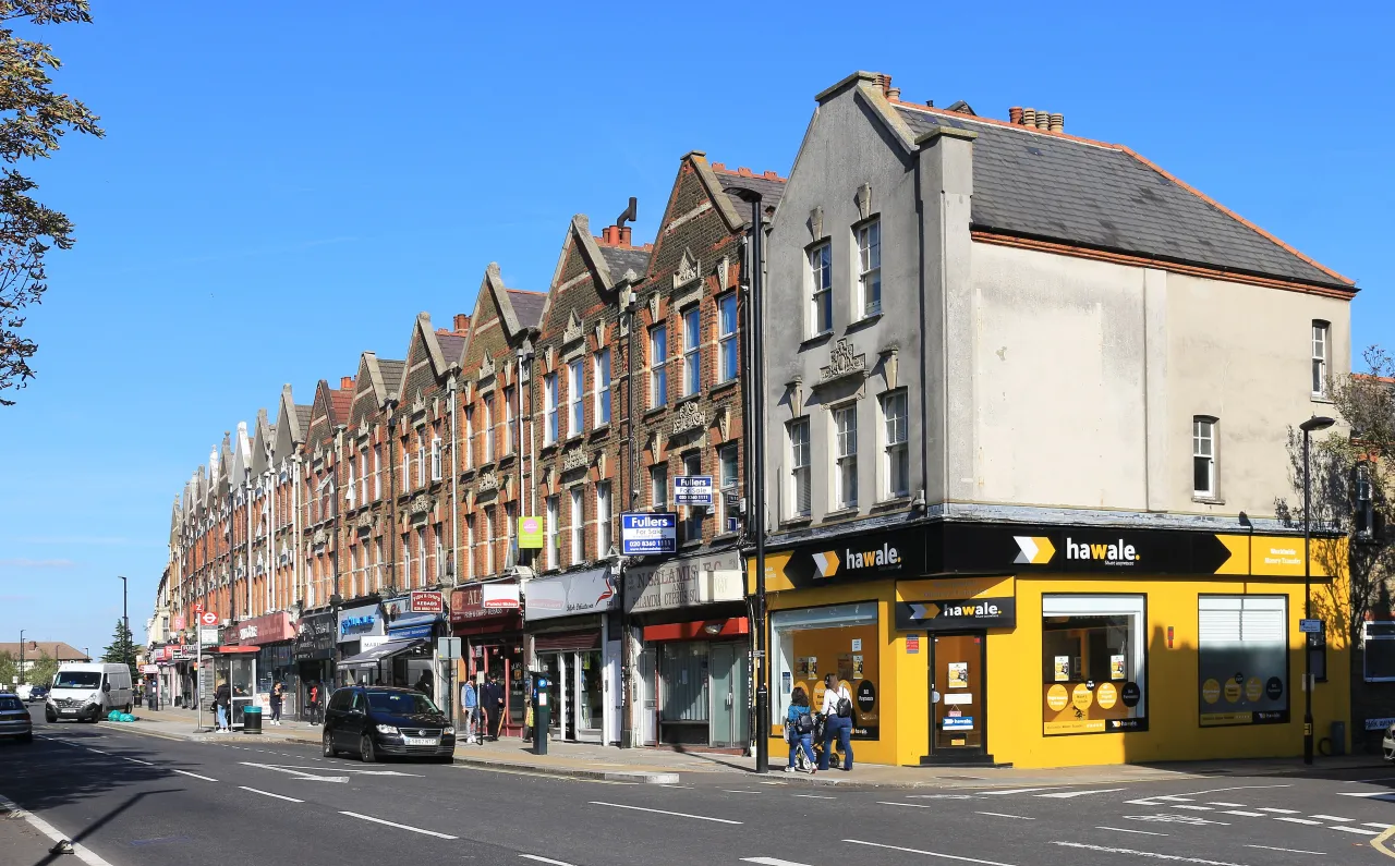 Shops and pedestrians along Green Lanes, Palmers Green's busy shopping street