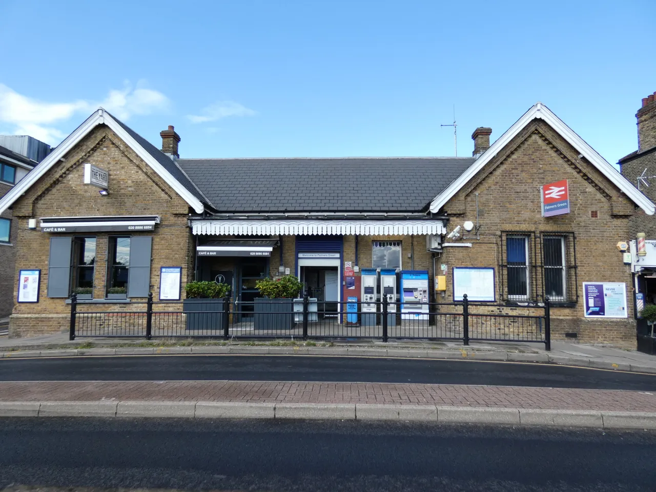 Palmers Green railway station building on a sunny day