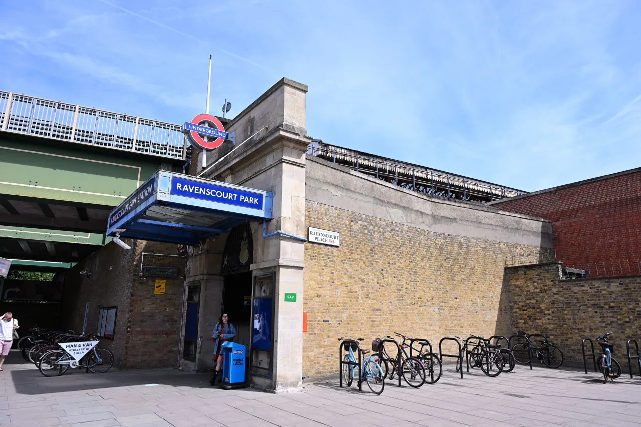 The entrance to Ravenscourt Park tube station, with its blue signage and cycle racks