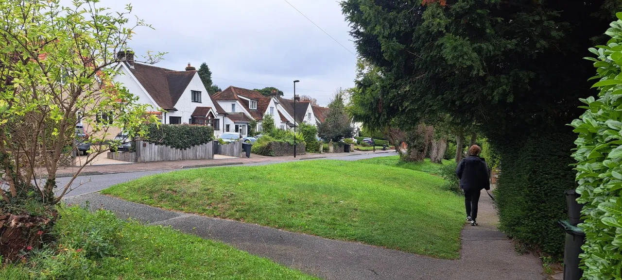 1930s houses on Riddlesdown Road, with a pedestrian on the pavement