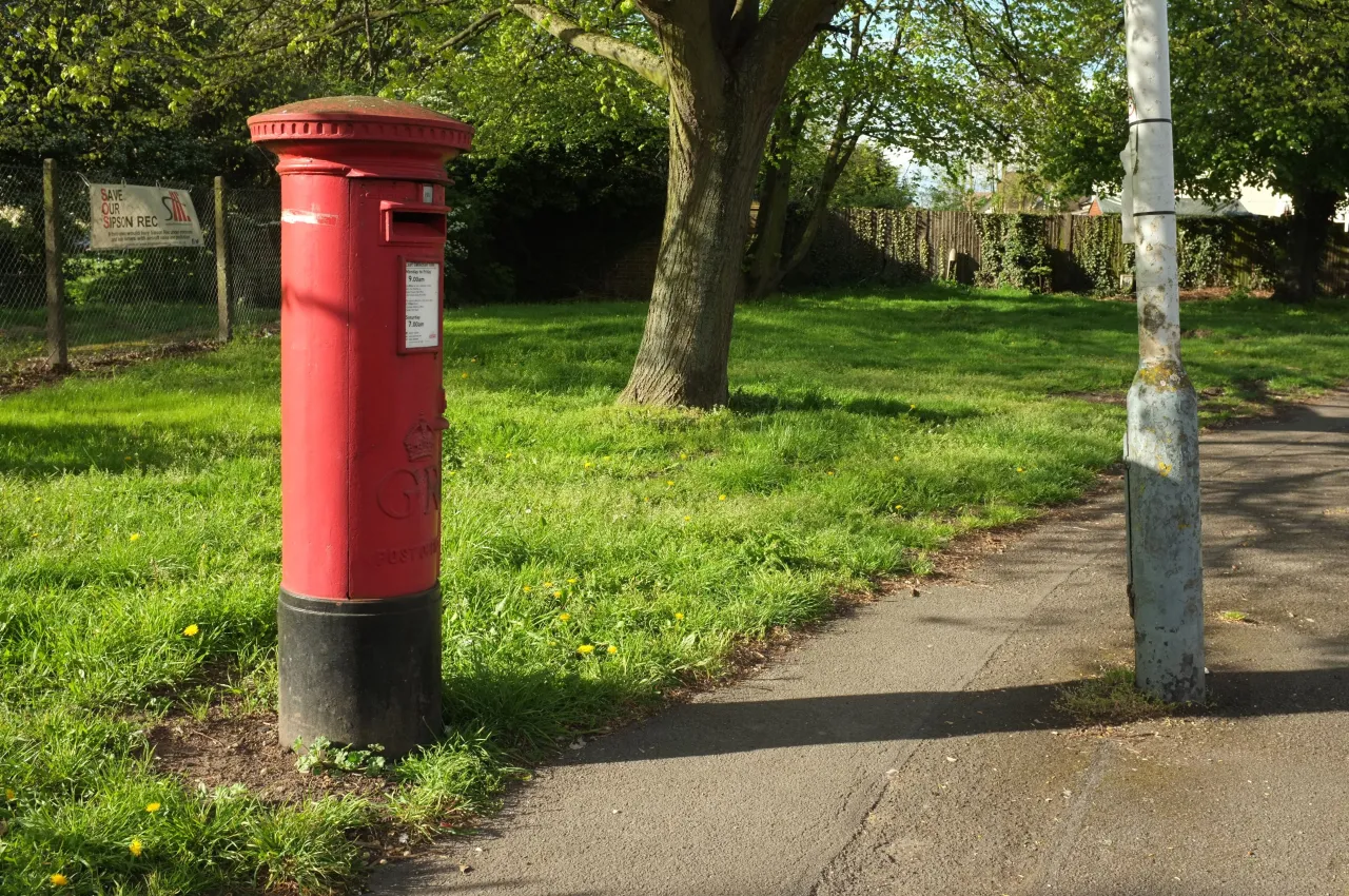 The green and a postbox on Sipson Way