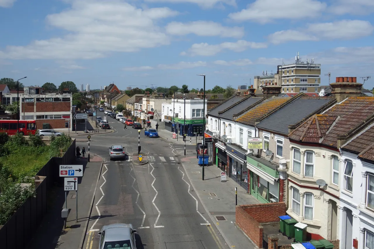 Abbey Wood high street with shops and traffic, near Slade Green in south-east London