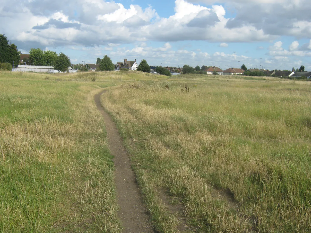 Grass footpath across Slade Green marshes near the railway station, Bexley