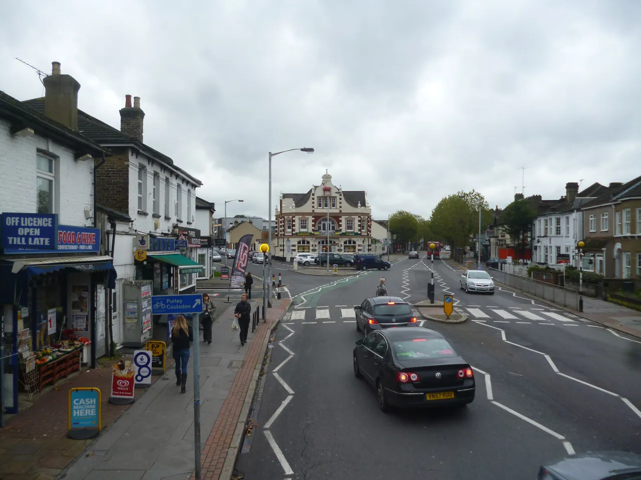 Brighton Road, South Croydon, with shops and pedestrians on the pavement