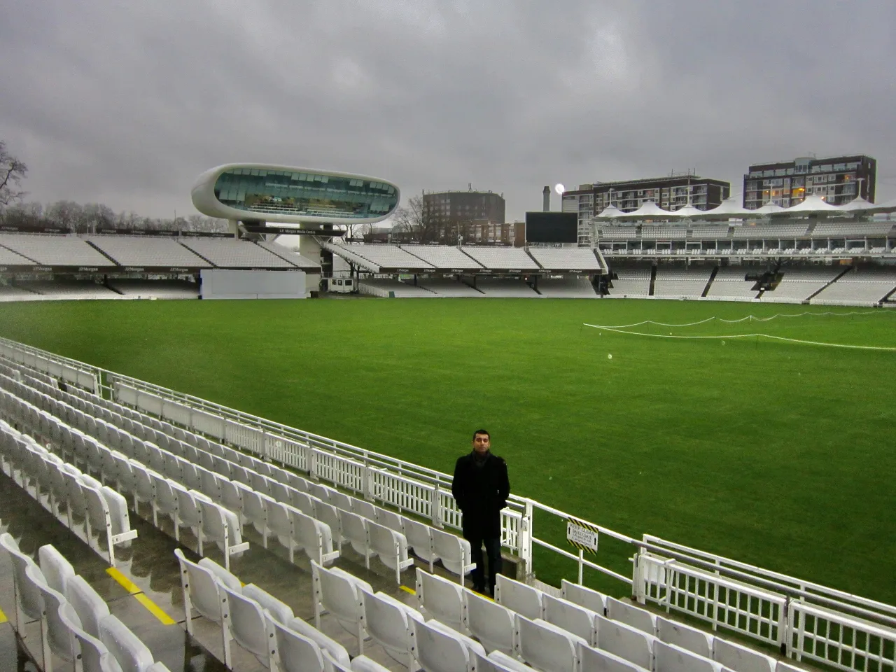The pitch and stands at Lord's Cricket Ground, with the media centre in the background