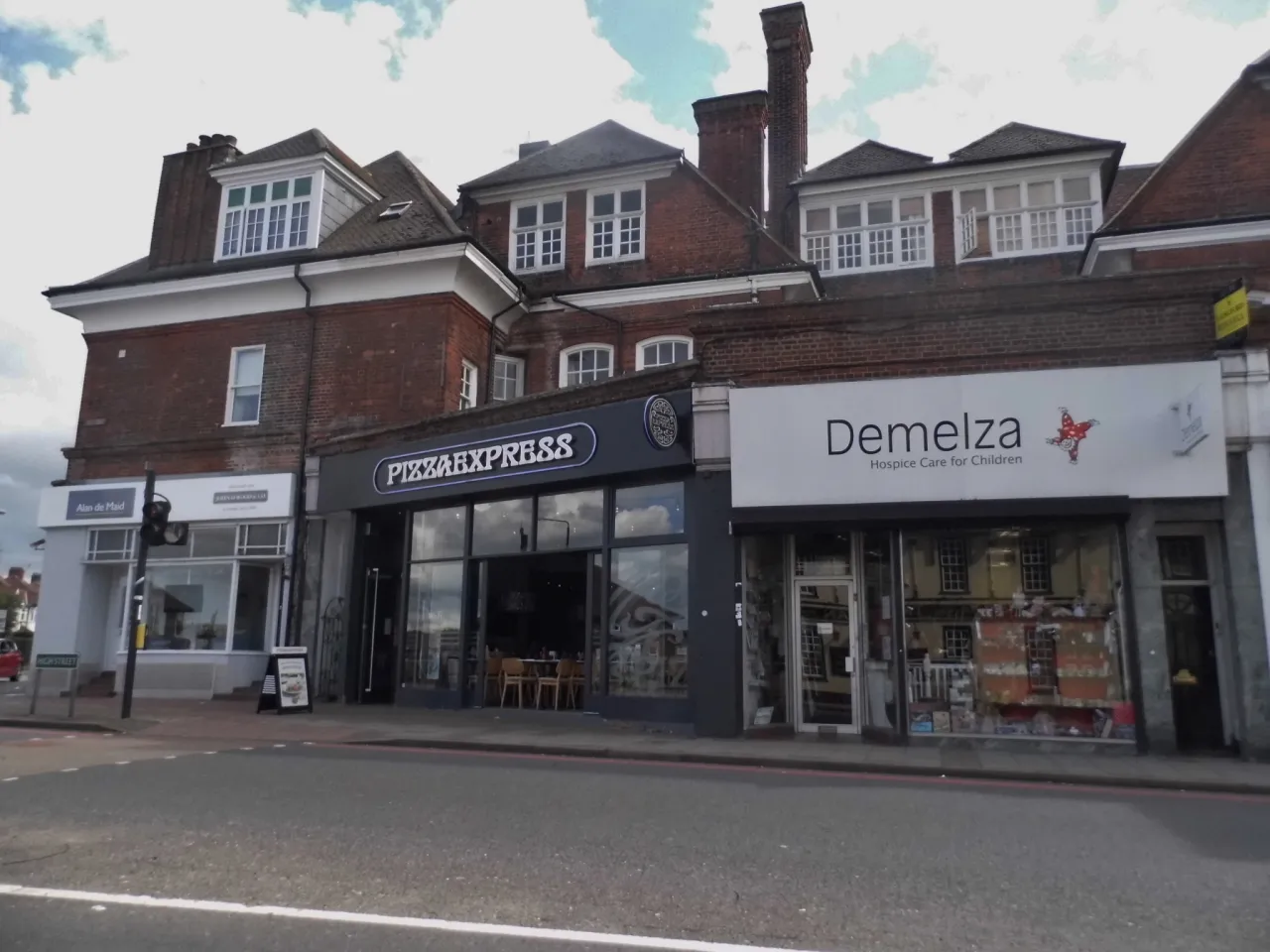 Shops along West Wickham High Street, Bromley, in daylight